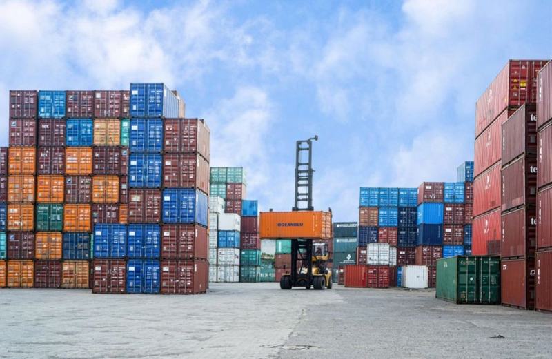 Stacked shipping containers at a port yard