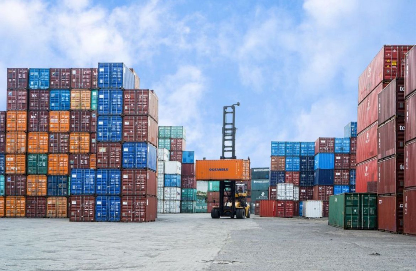 Stacked shipping containers at a port yard