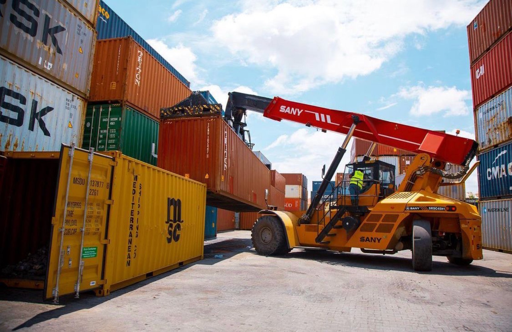 Reach stacker handling containers